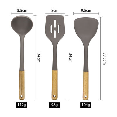 Cucina in silicone Set in tre pezzi Scala resistente al calore Cucchiaio antiaderente Maniglia di legno